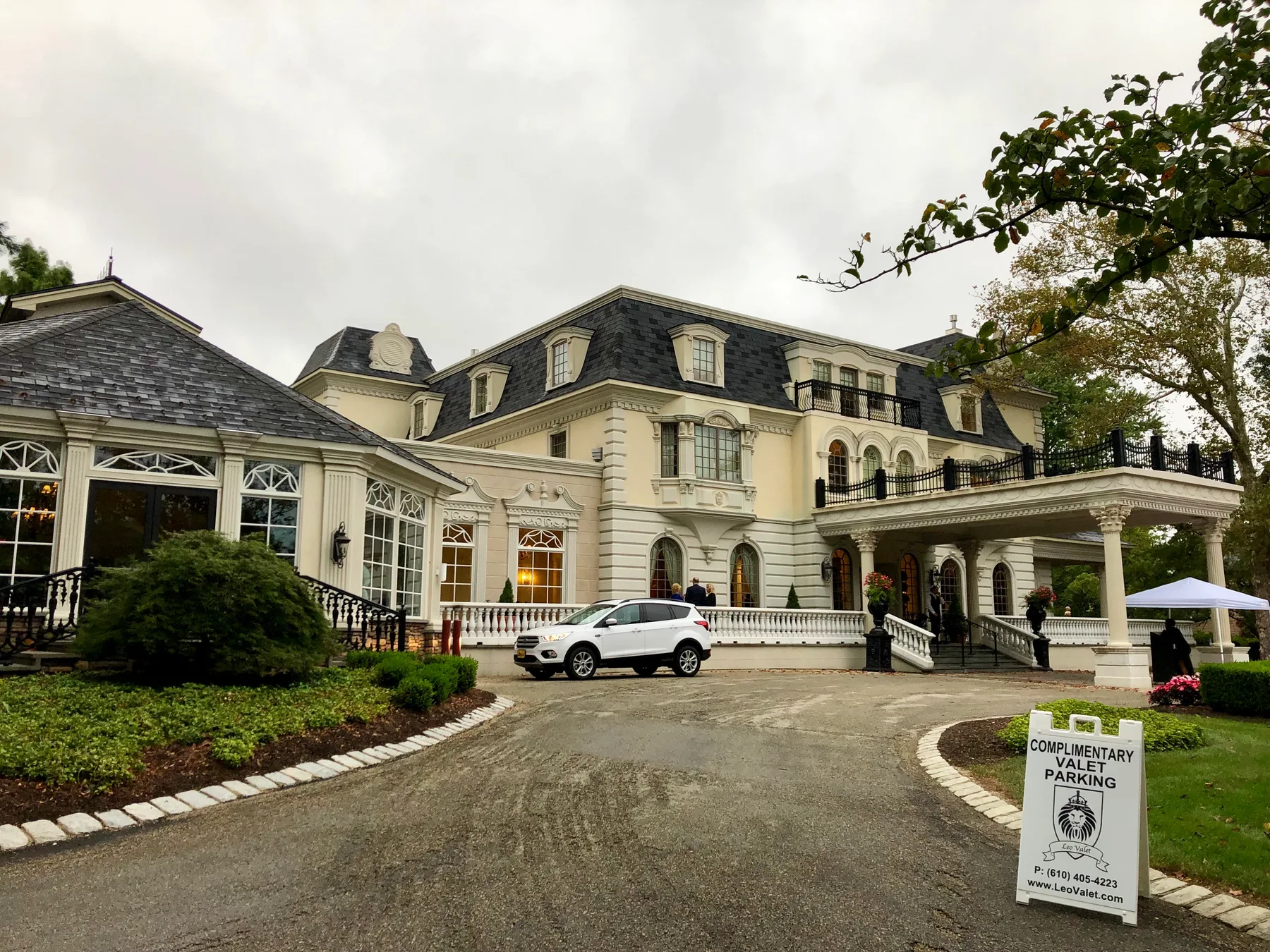 A valet stand beside a venue driveway